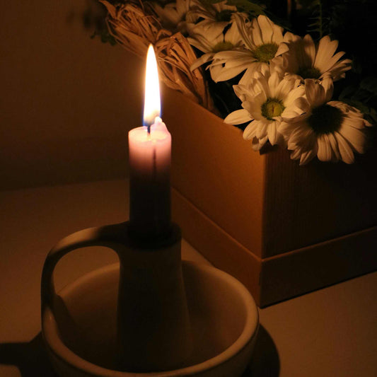 Glowing Tranquility: Light Beeswax Tapers in Serene Ambiance