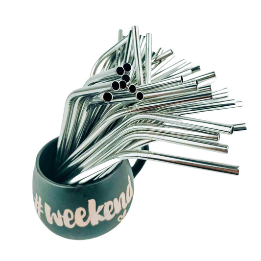 EcoLux Stainless Steel Straws set with cleaning brush on a bamboo background, showcasing the elegance and durability of reusable drinkware accessories.