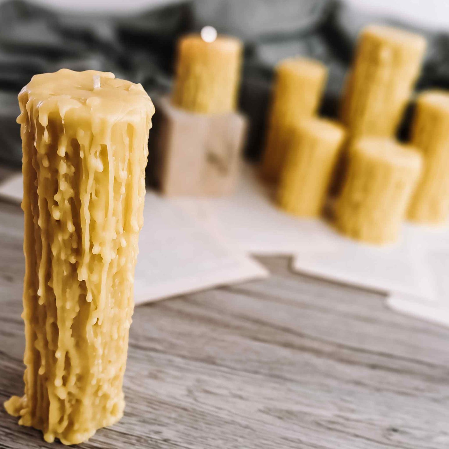 Close-up of a clean-burning beeswax candle flame, emphasizing its non-toxic, eco-friendly nature in a cozy setting