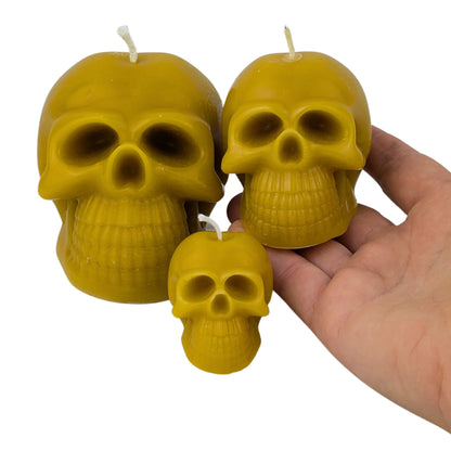 Handmade beeswax skull candles for gothic home décor.