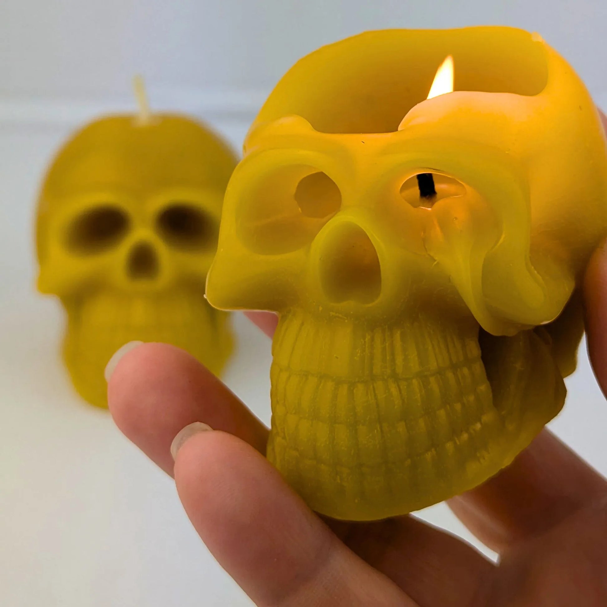 Eco-friendly beeswax skull candles for gothic décor lovers.