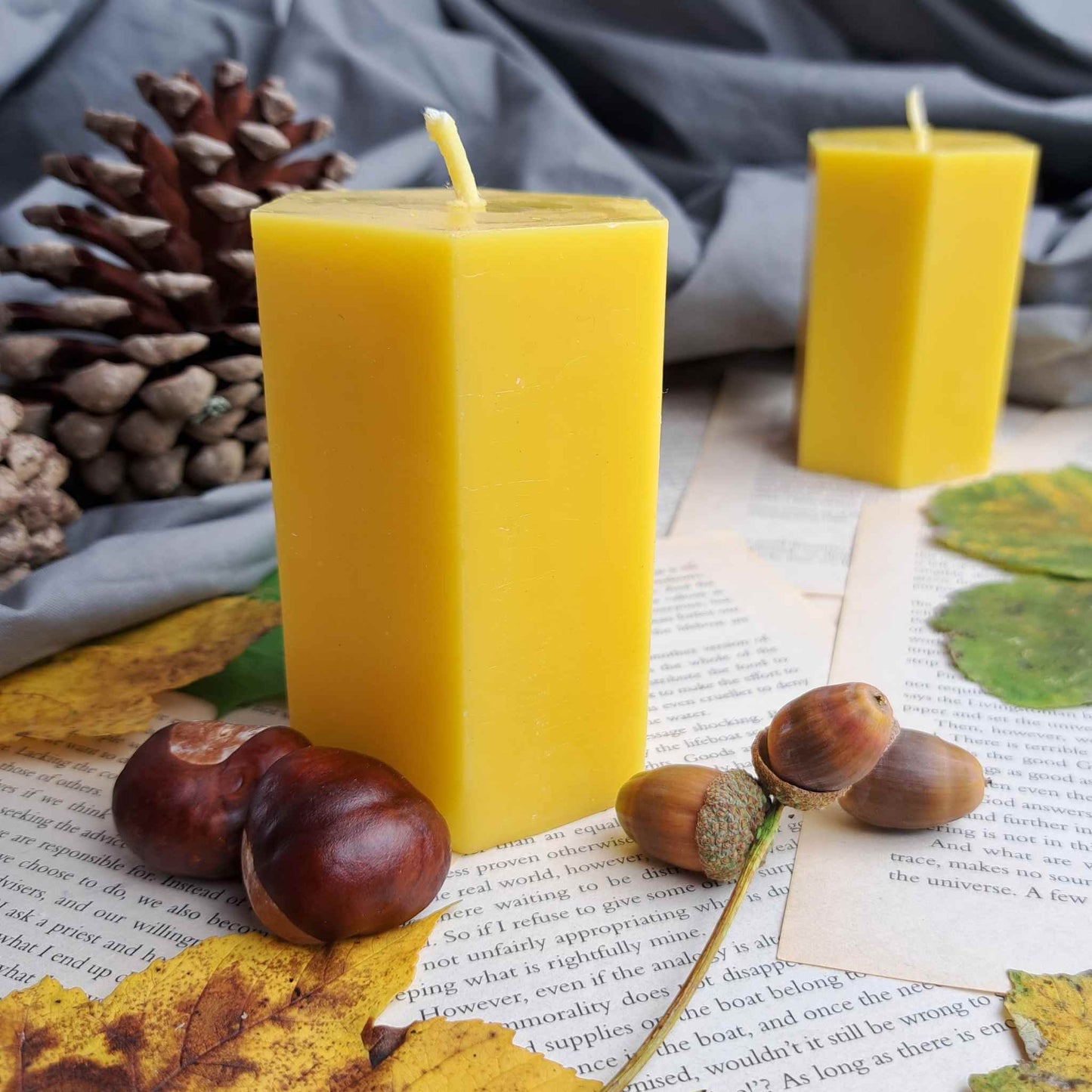 Handcrafted hexagonal pure beeswax pillar candle, eco-friendly and natural, perfect for adding a touch of elegance to home decor.