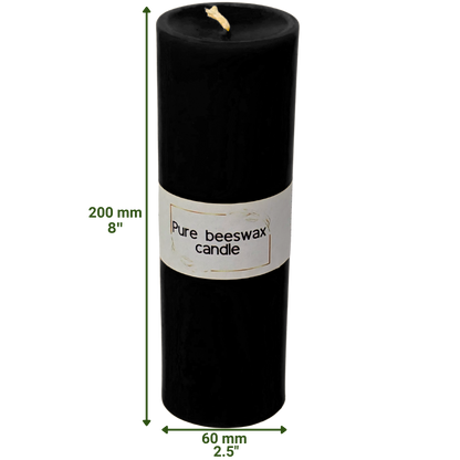 A single, pure black beeswax pillar candle lit in a dim room, casting warm, inviting shadows and creating a peaceful, tranquil ambiance.