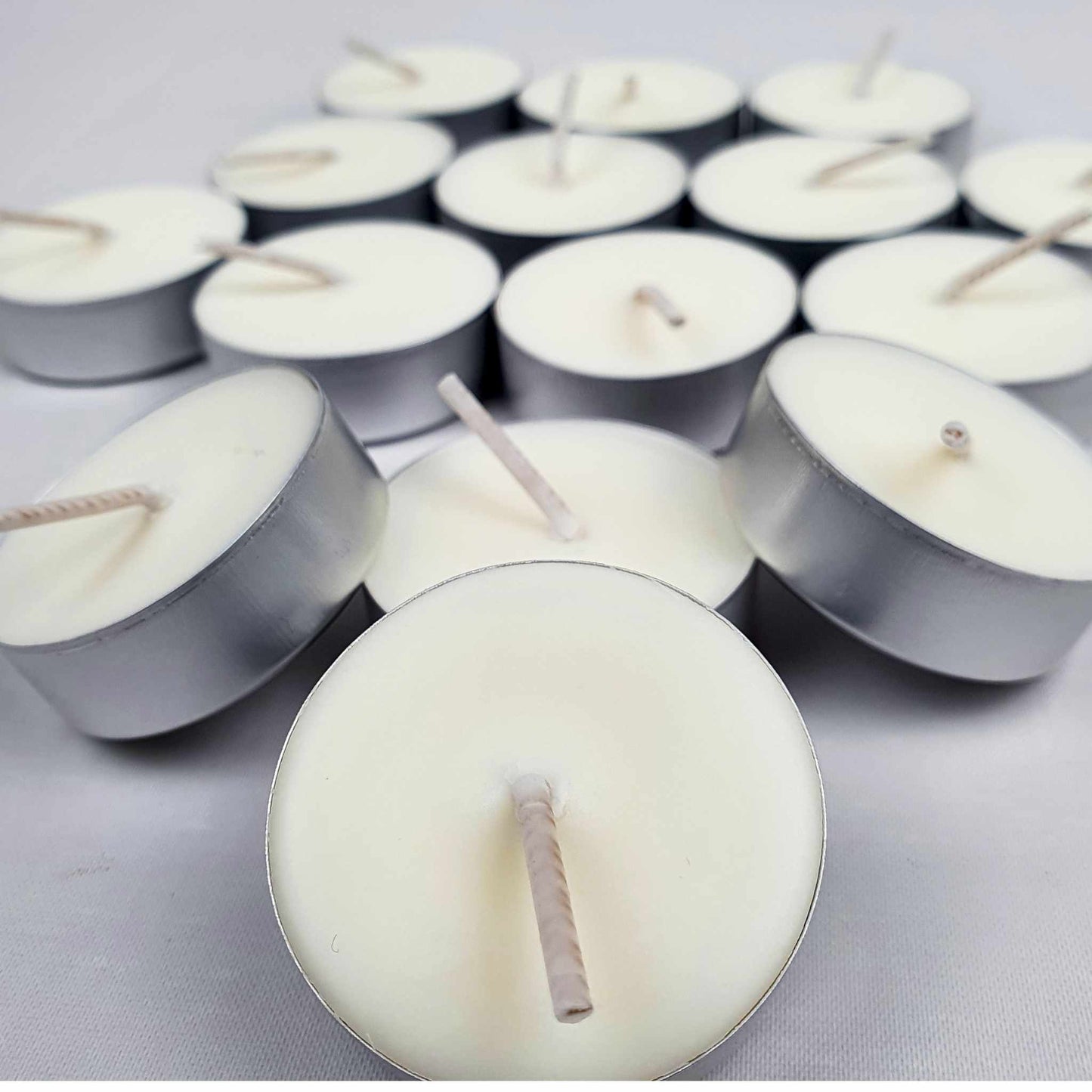 Sustainable soy wax tealights with refill options, offering a natural, toxin-free burn for eco-conscious homes.