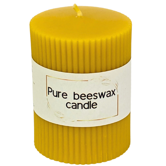 Handcrafted fluted pure beeswax pillar candle with a natural, radiant glow for eco-conscious home decor.