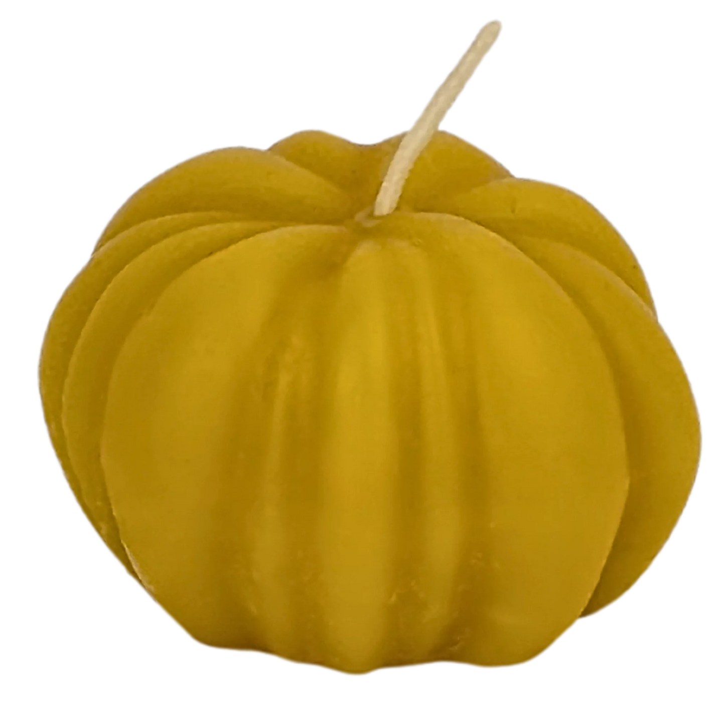 Handcrafted pure beeswax candle shaped like a pumpkin, perfect for adding a cozy autumn ambiance to any home, made in the UK.